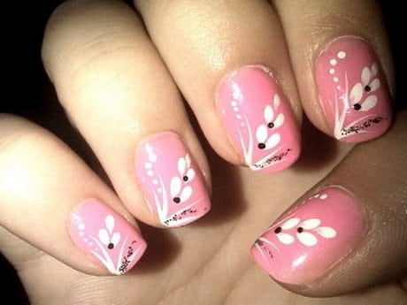 Nail styles with pink enamel and white petal flowers with black dots