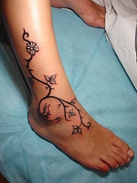 flowers and branches on lower leg and foot
